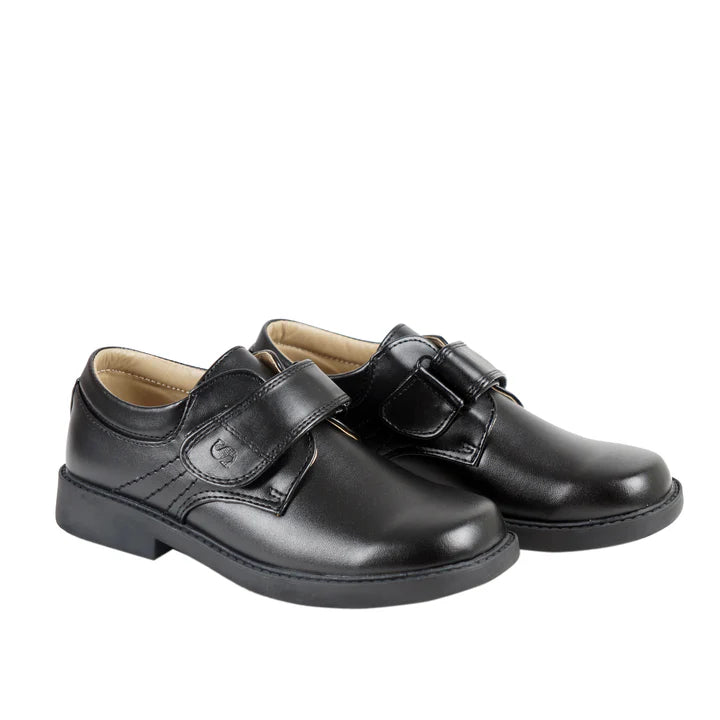 Pair of black dress shoes with velcro straps on a white background